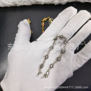 A simple and individual antique golden cross-flower diamond-encrusted thin bracelet for a couple